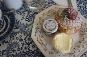 Scones, clotted cream and jam served in a typical English Tea House. Cream tea in Bath.